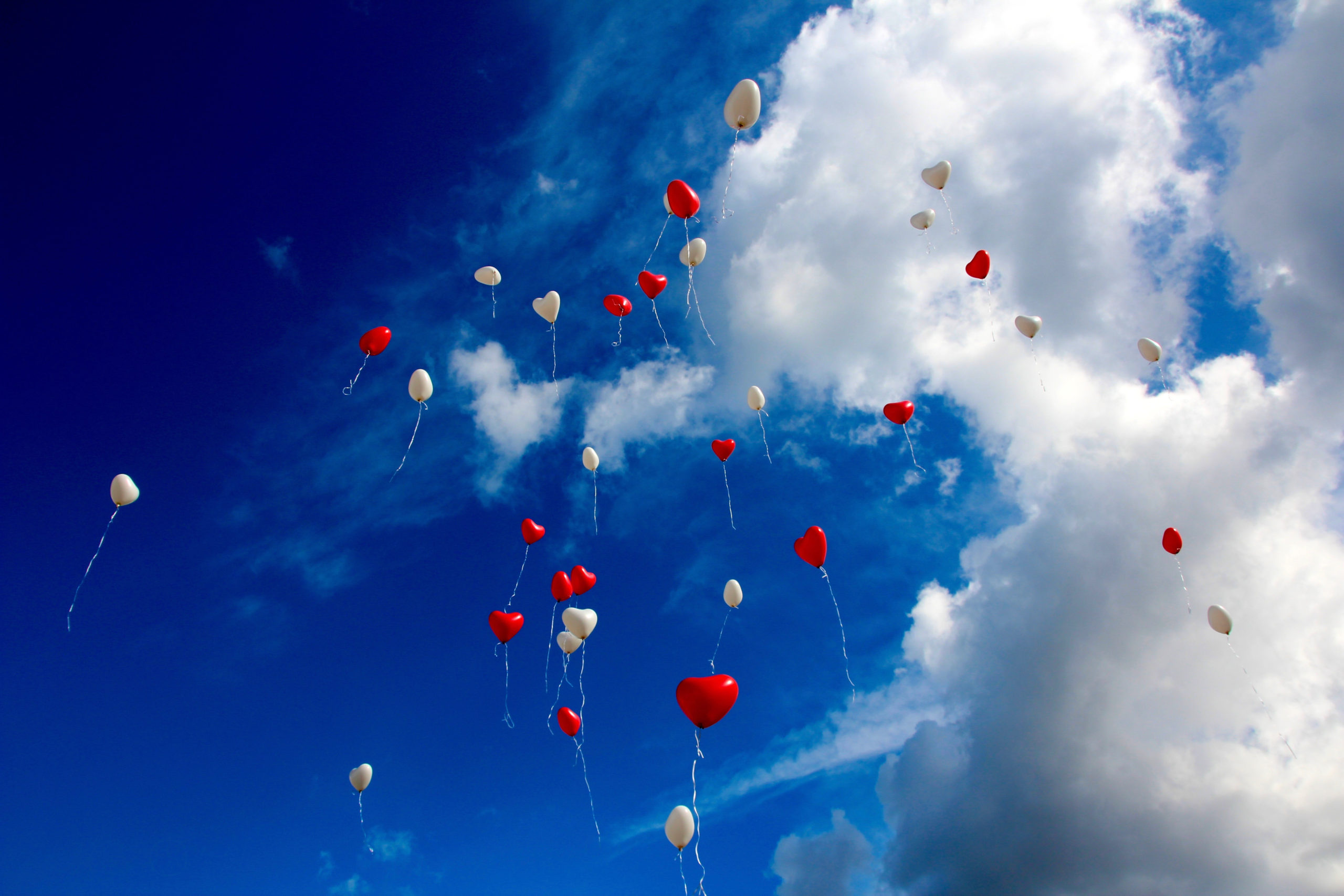 Canva - White and Red Plastic Heart Balloon on Sky during Daytime